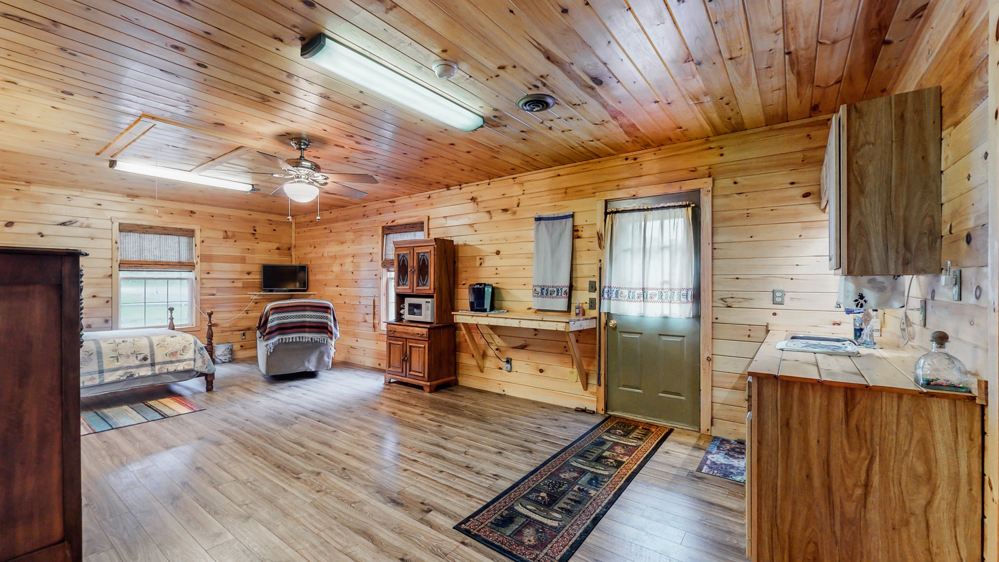 1243 White Road Bon Aqua, TN 37025 - Photo 25 of 42 a large room with wooden furniture