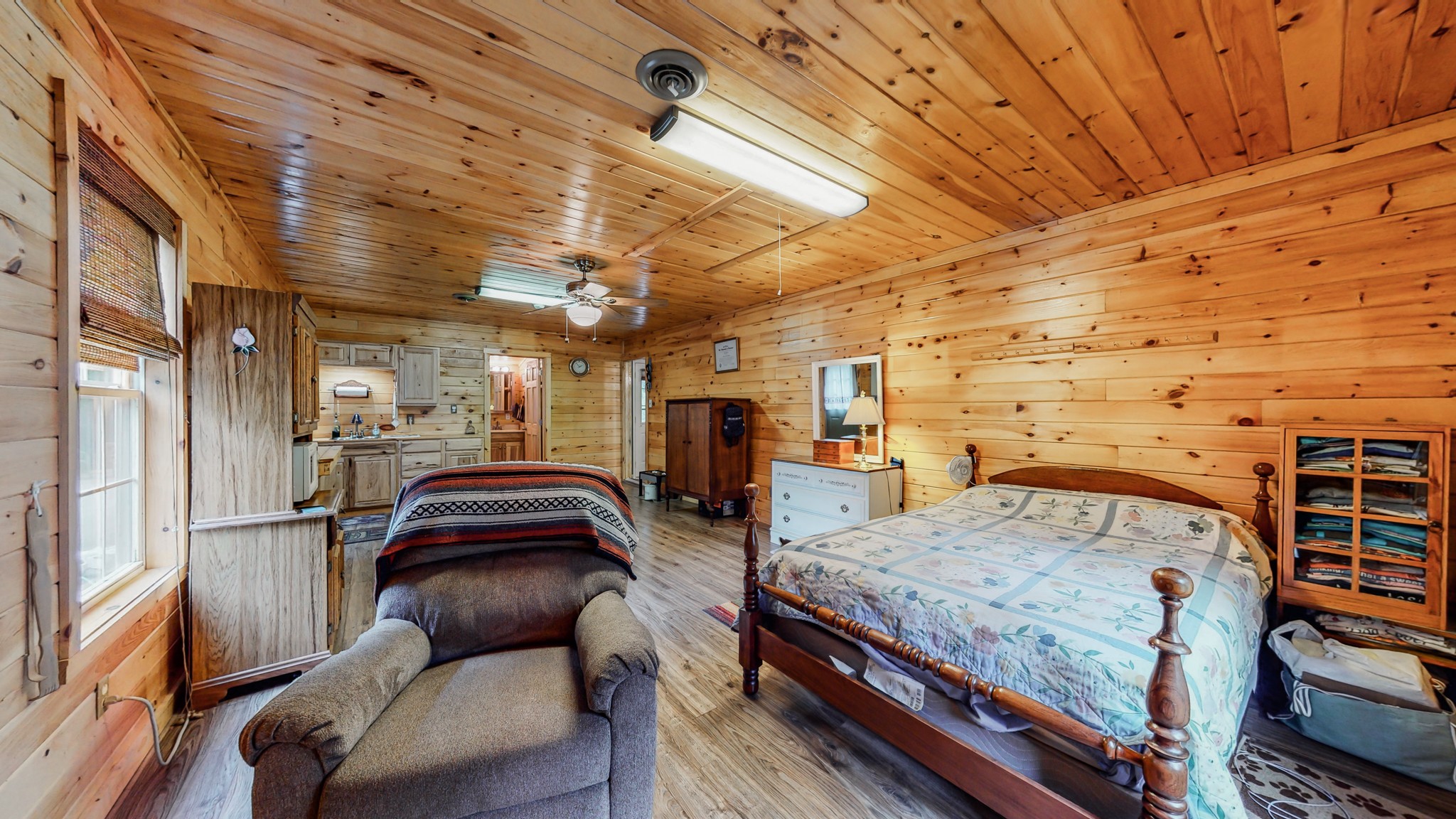 1243 White Road Bon Aqua, TN 37025 - Photo 29 of 42 a bedroom with furniture and a wooden floor