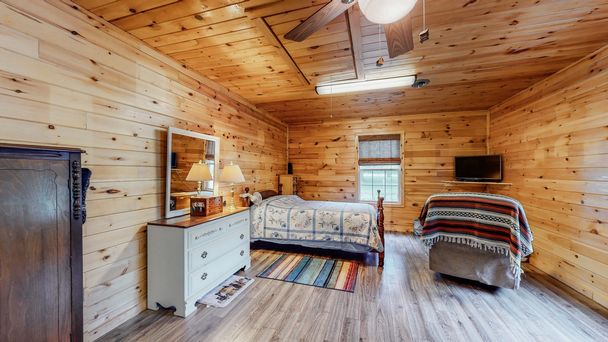 1243 White Road Bon Aqua, TN 37025 - Photo 31 of 42 a bedroom with furniture and a wooden floor
