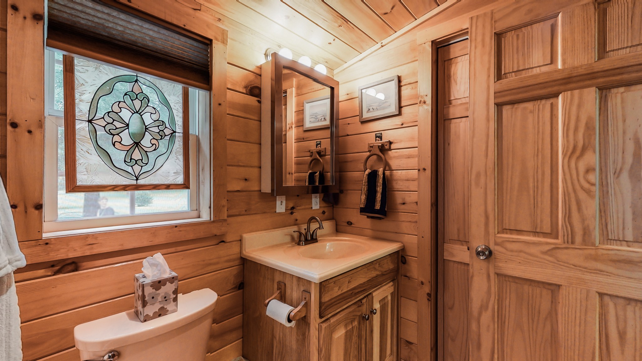 1243 White Road Bon Aqua, TN 37025 - Photo 34 of 42 a bathroom with a sink a mirror and a window
