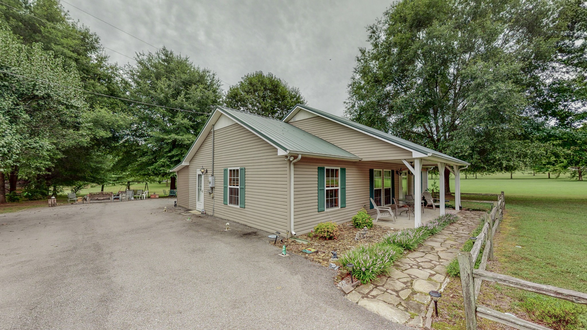 1243 White Road Bon Aqua, TN 37025 - Photo 35 of 42 a house with trees in the background