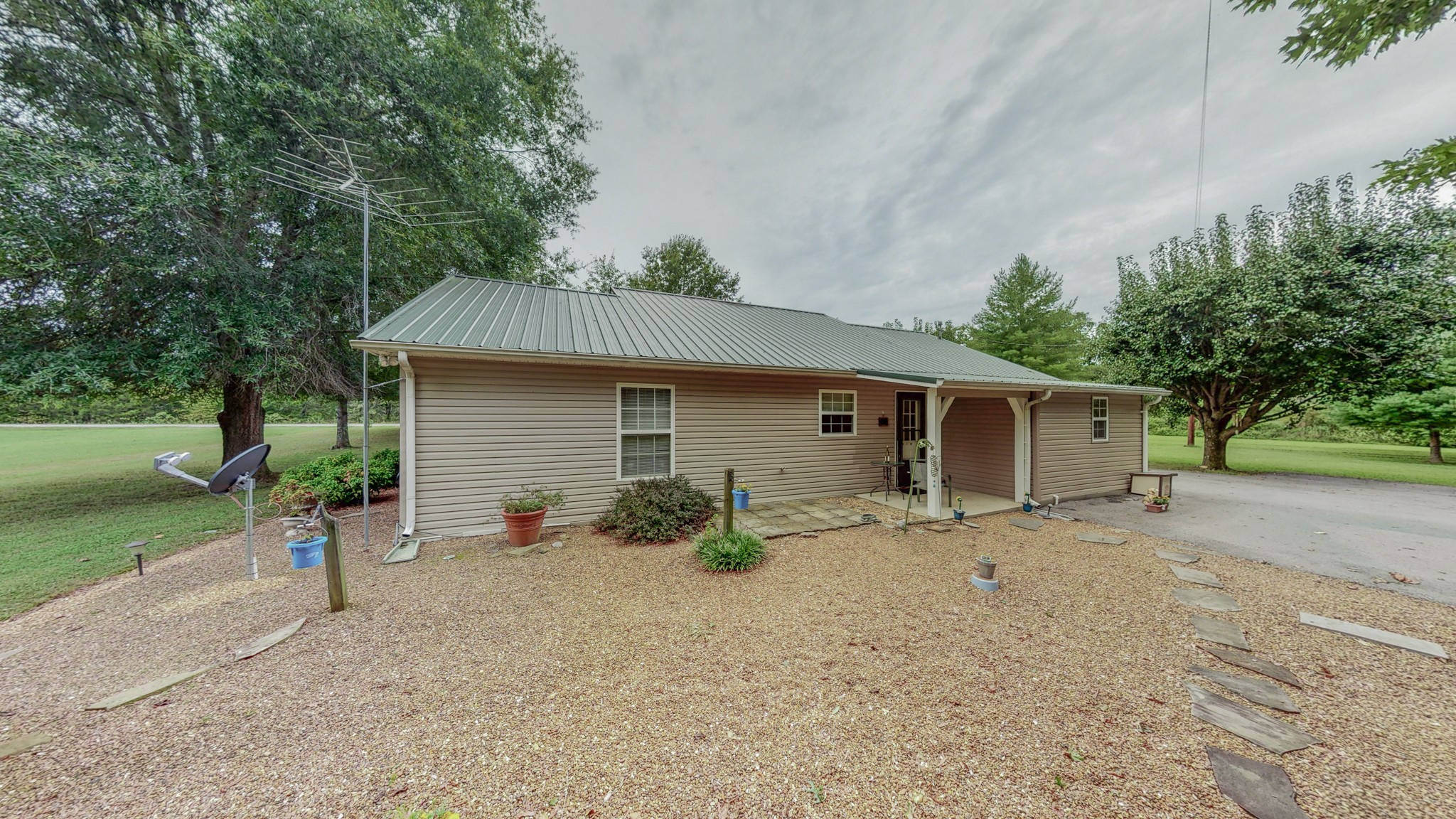 1243 White Road Bon Aqua, TN 37025 - Photo 37 of 42 a view of a house with backyard and trees