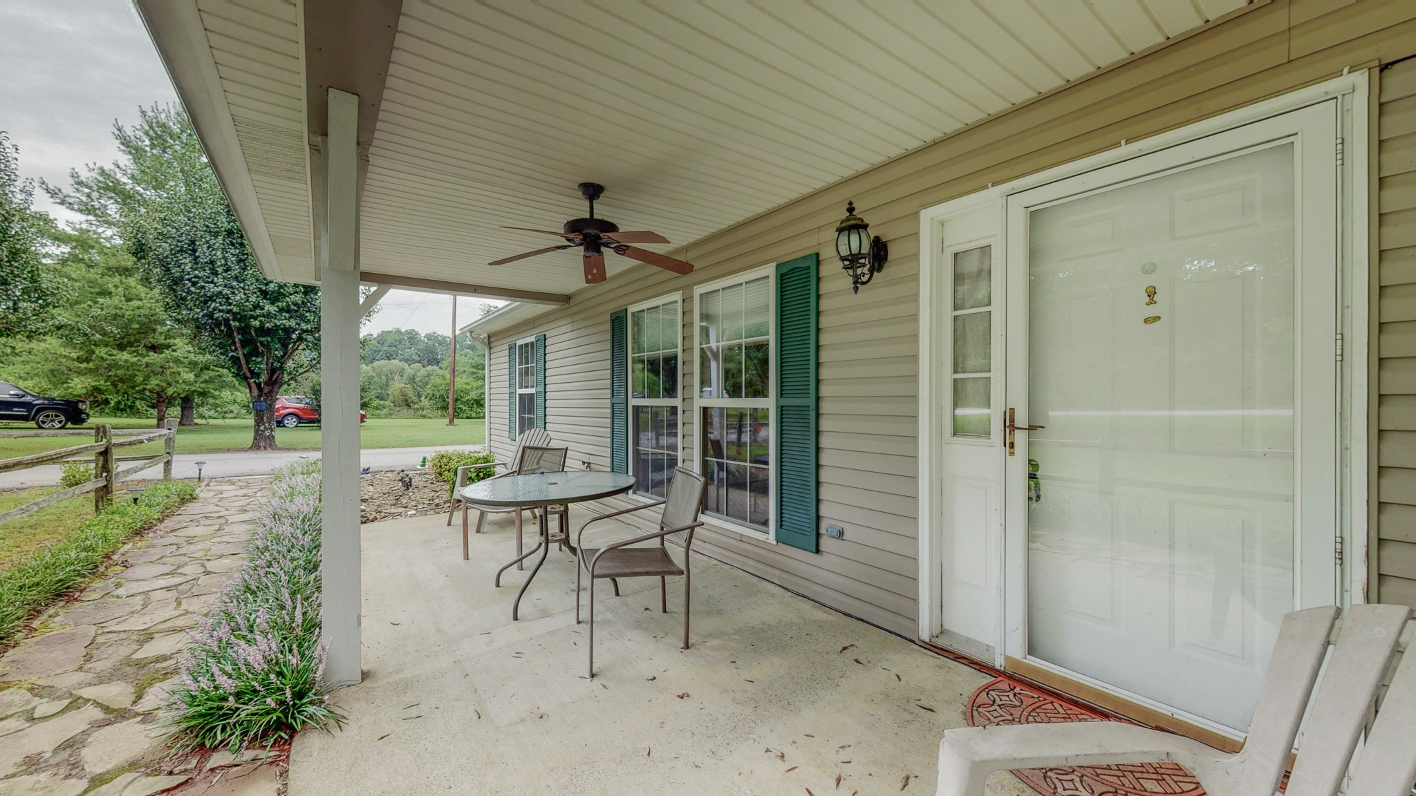1243 White Road Bon Aqua, TN 37025 - Photo 40 of 42 a view of a porch with chairs and backyard