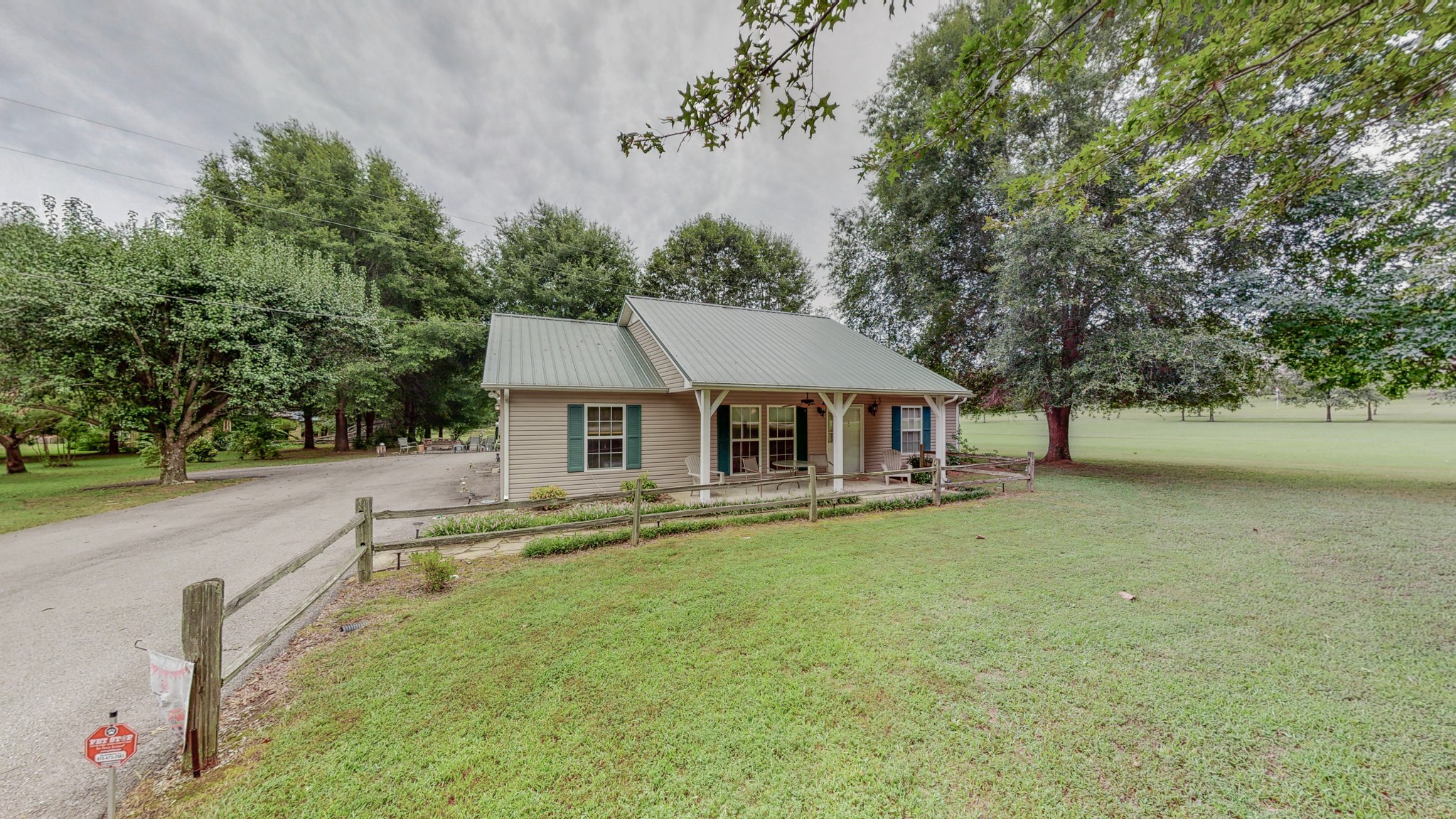 1243 White Road Bon Aqua, TN 37025 - Photo 4 of 42 a house with trees in the background
