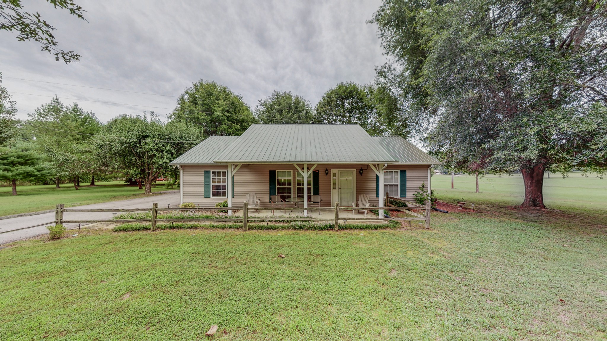 1243 White Road Bon Aqua, TN 37025 - Photo 5 of 42 a backyard of a house with table and chairs