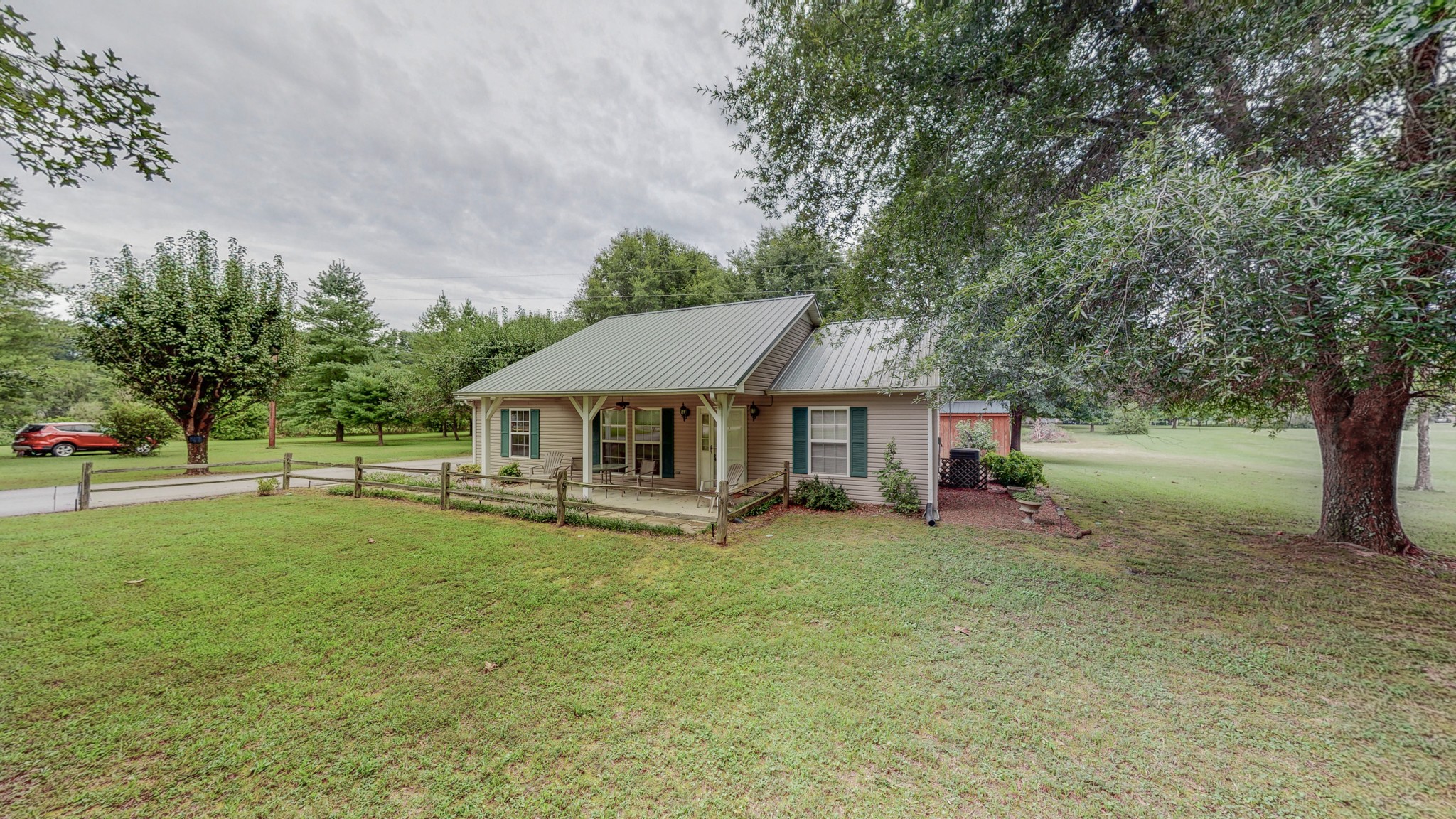 1243 White Road Bon Aqua, TN 37025 - Photo 6 of 42 a view of a house with backyard and tree
