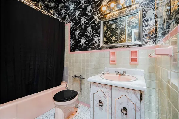 a bathroom with a sink and a toilet