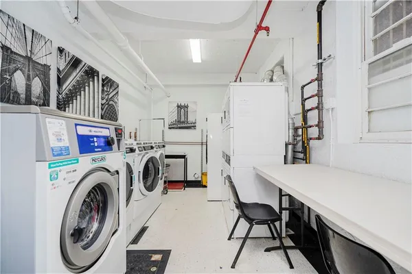 a view of livingroom with washer and dryer