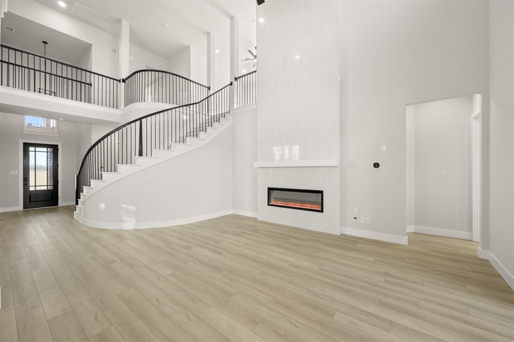 1104 Flock Drive Mansfield, TX 76063 - Photo 8 of 30 a view of entryway and hall with wooden floor