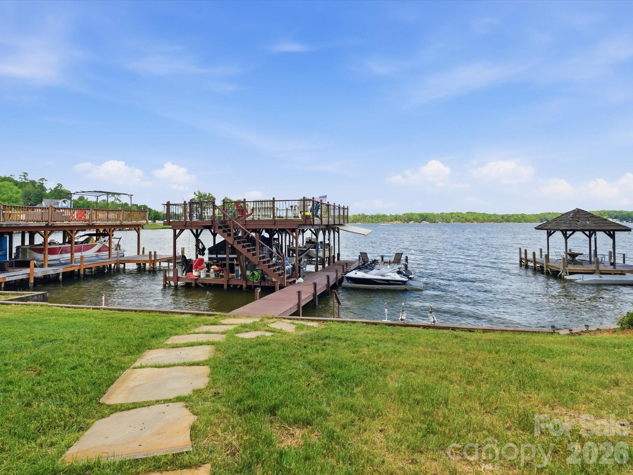 562 Lake Head Road Norwood, NC 28128 - Photo 3 of 43 a view of a lake with a yard
