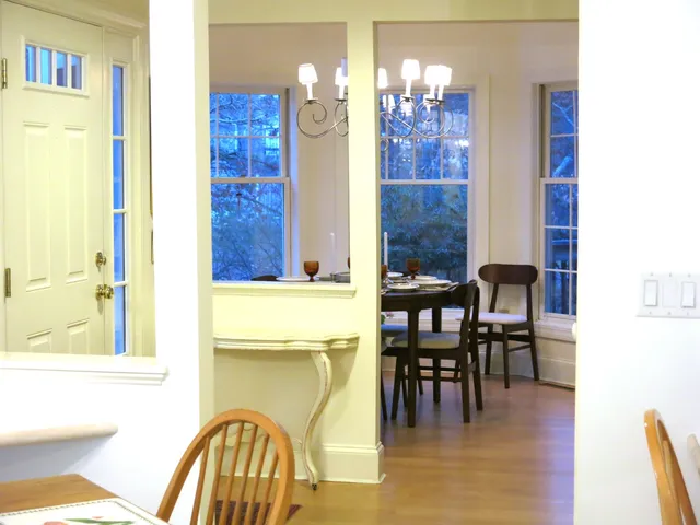 a dining room with furniture and chandelier