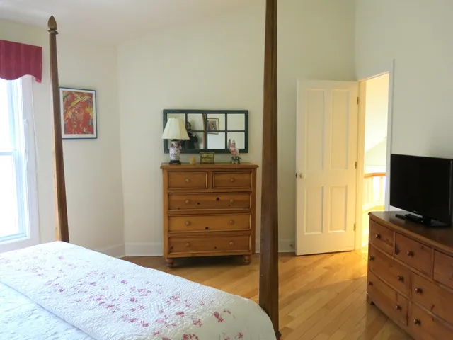 a bedroom with a bed and furniture