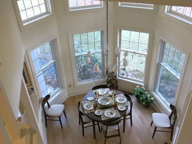 a view of a dining room with furniture and wooden floor