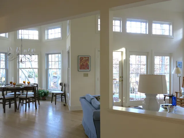 a view of a dining room with furniture and chandelier