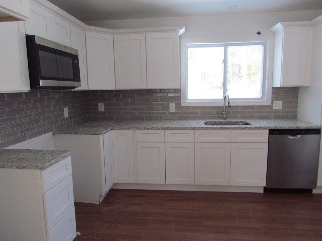 116 Williamsville Road Hubbardston, MA 01452 - Photo 16 of 27 a kitchen with a sink cabinets and window