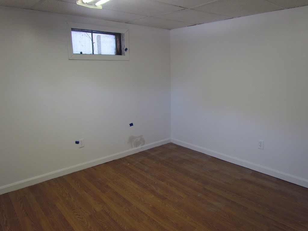 116 Williamsville Road Hubbardston, MA 01452 - Photo 25 of 27 a view of an empty room with wooden floor and a window