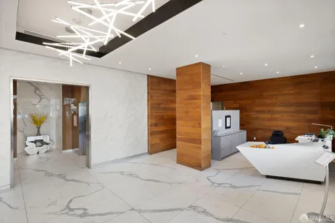 a view of a hallway with seating area