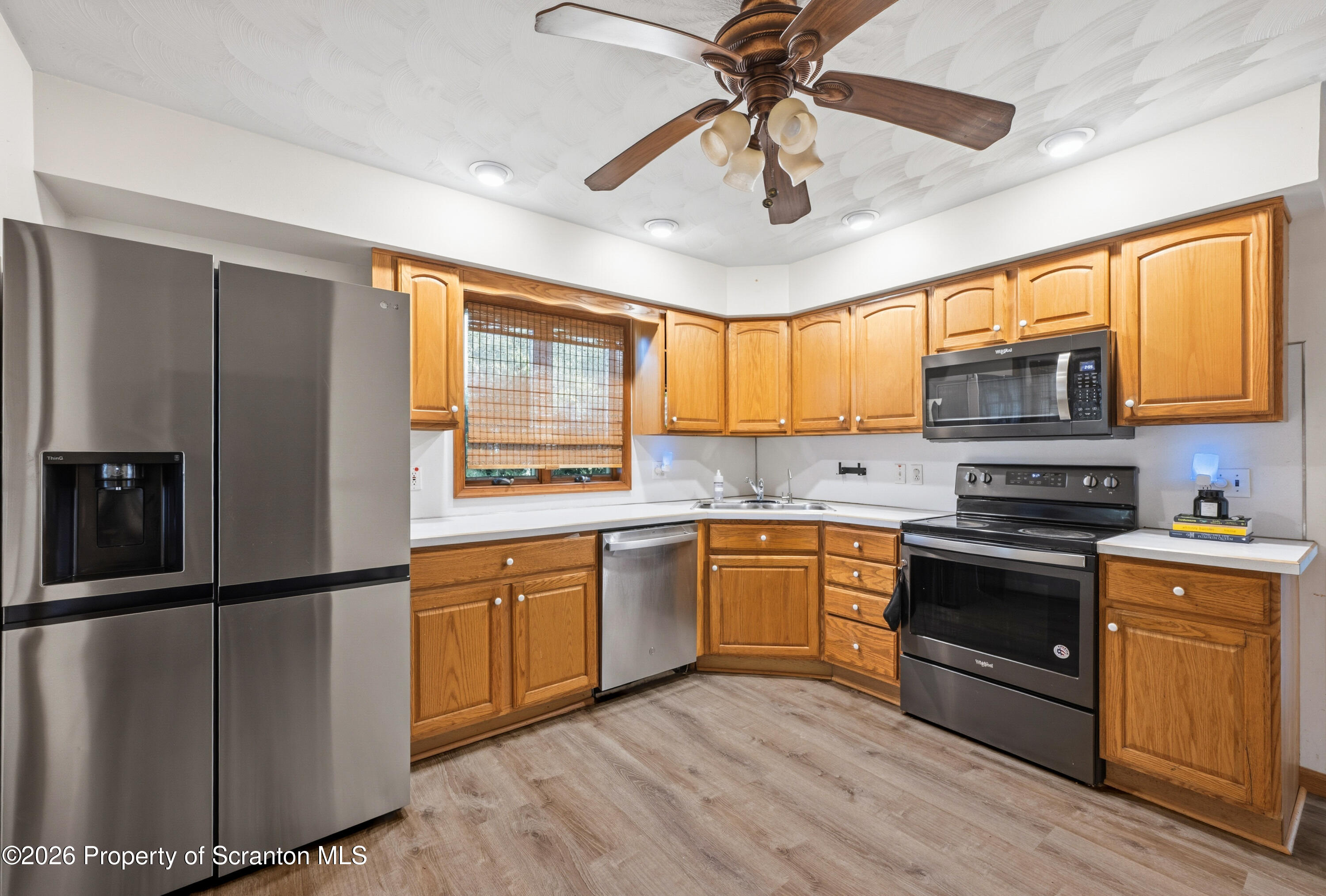 435 Foote Avenue Duryea, PA 18642 - Photo 13 of 51 a kitchen with stainless steel appliances granite countertop a stove cabinets and refrigerator