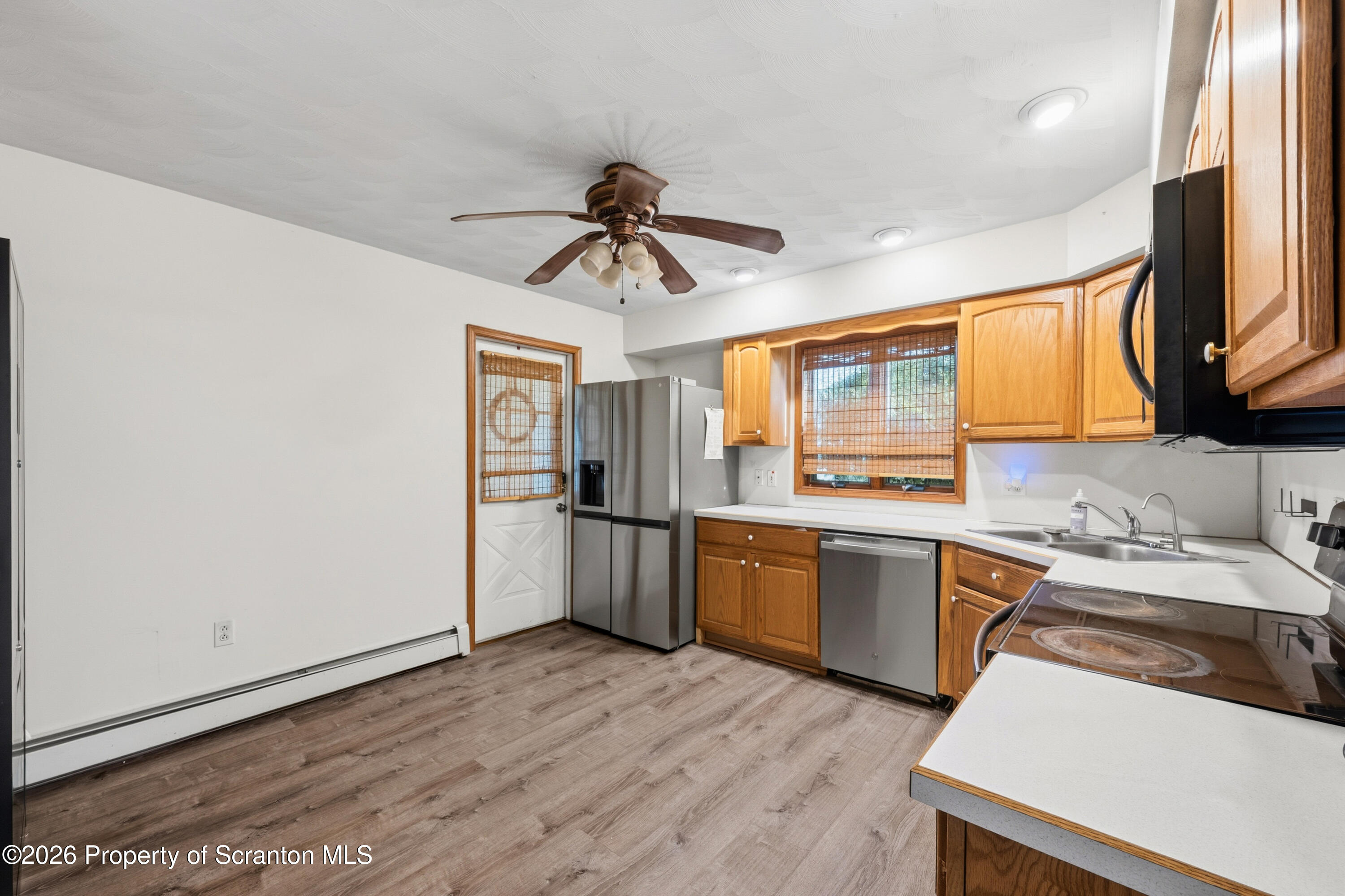 435 Foote Avenue Duryea, PA 18642 - Photo 14 of 51 a kitchen with granite countertop a sink stainless steel appliances and cabinets
