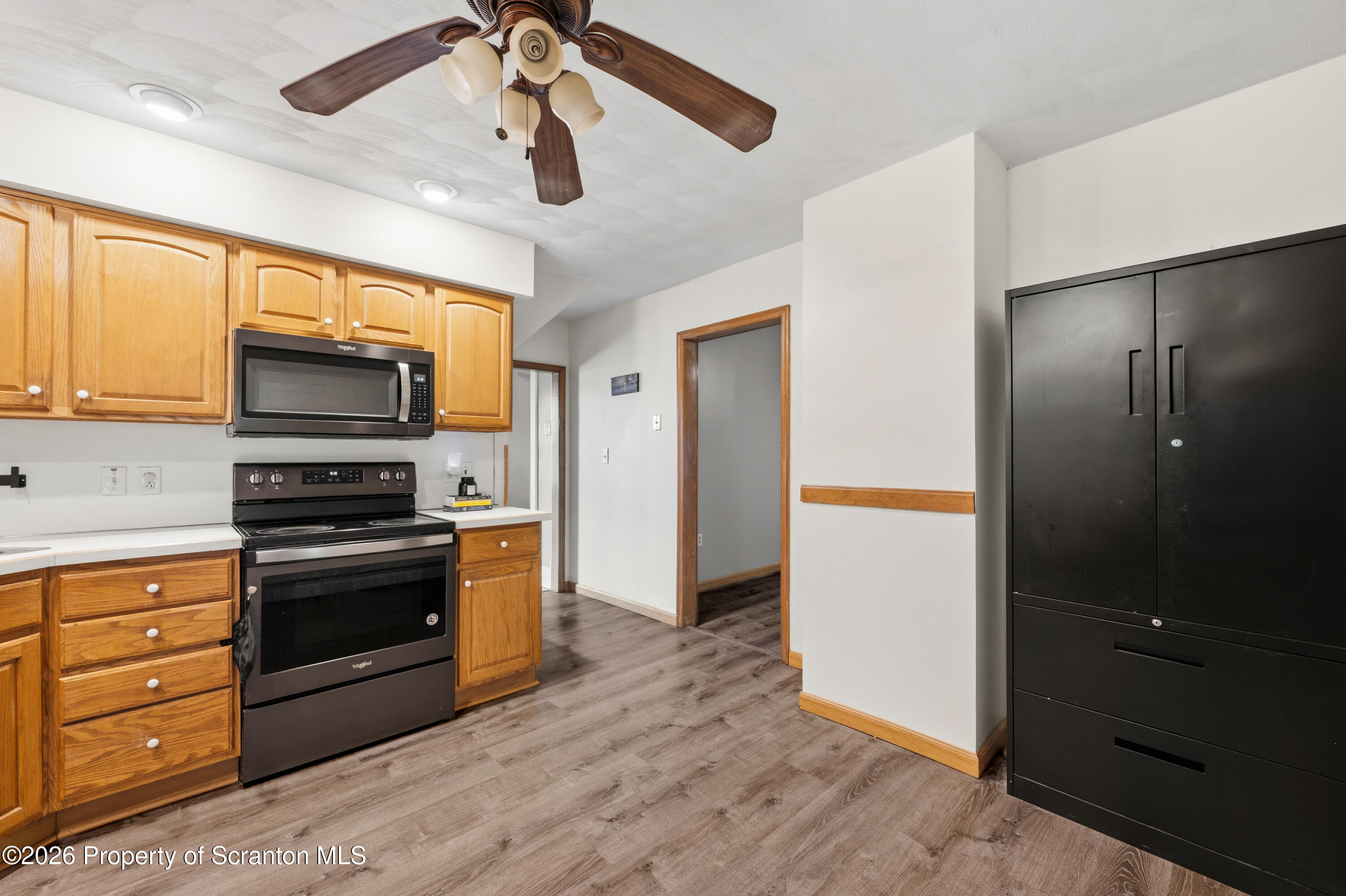 435 Foote Avenue Duryea, PA 18642 - Photo 16 of 51 a kitchen with stainless steel appliances granite countertop a stove and a refrigerator