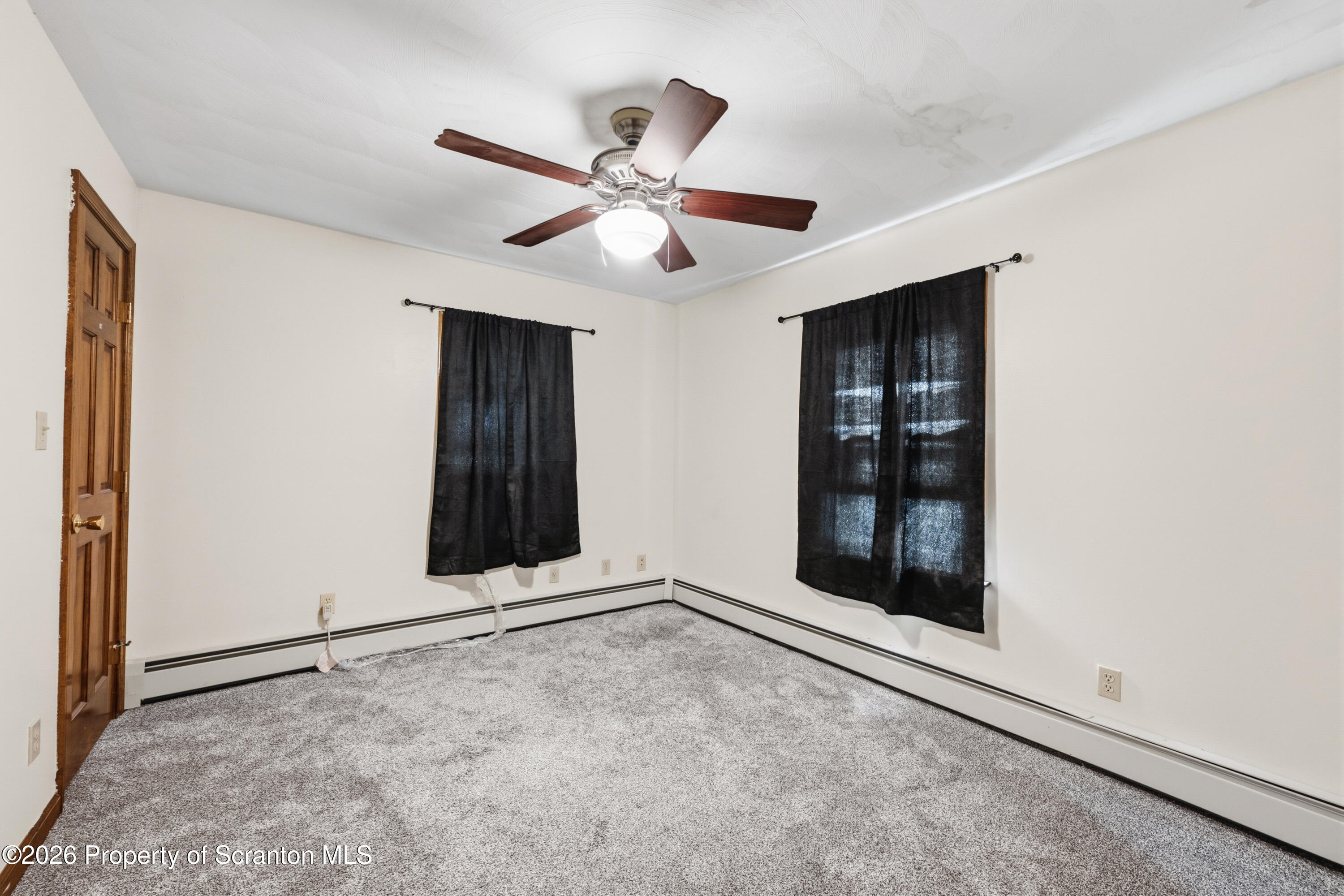 435 Foote Avenue Duryea, PA 18642 - Photo 20 of 51 an empty room with windows and fan