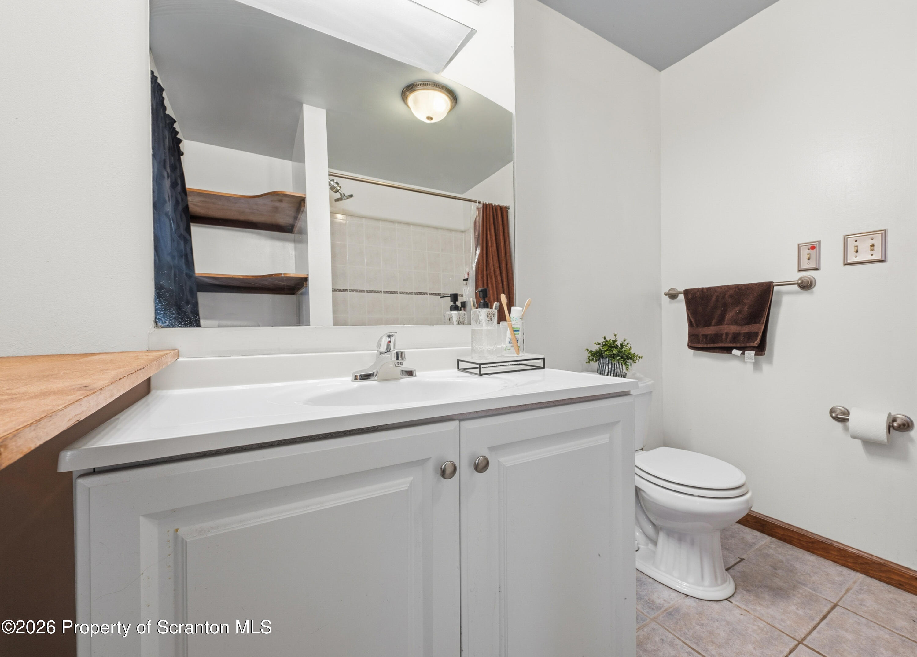 435 Foote Avenue Duryea, PA 18642 - Photo 21 of 51 a bathroom with a toilet sink and mirror