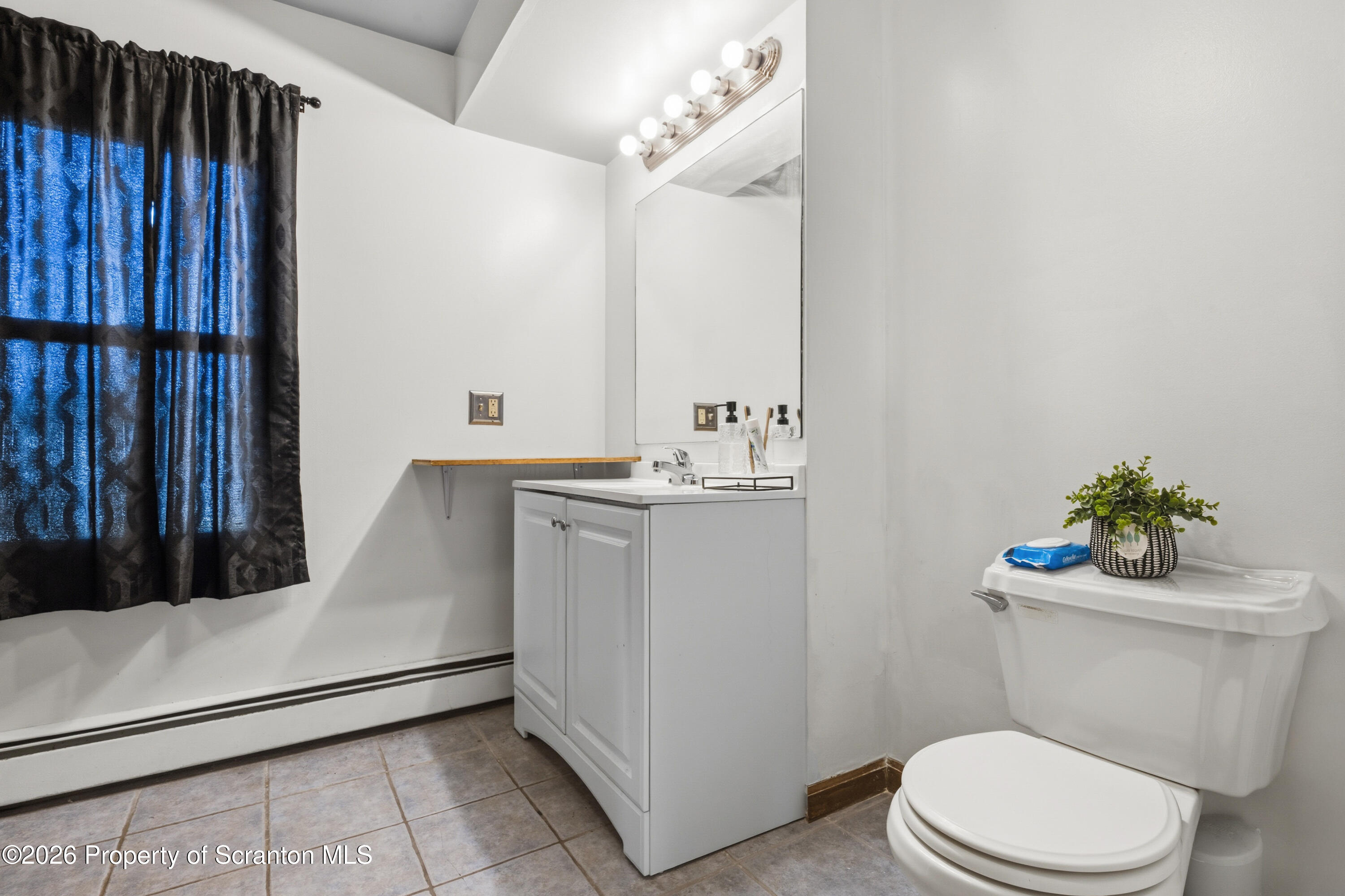 435 Foote Avenue Duryea, PA 18642 - Photo 22 of 51 a bathroom with a sink a toilet and mirror