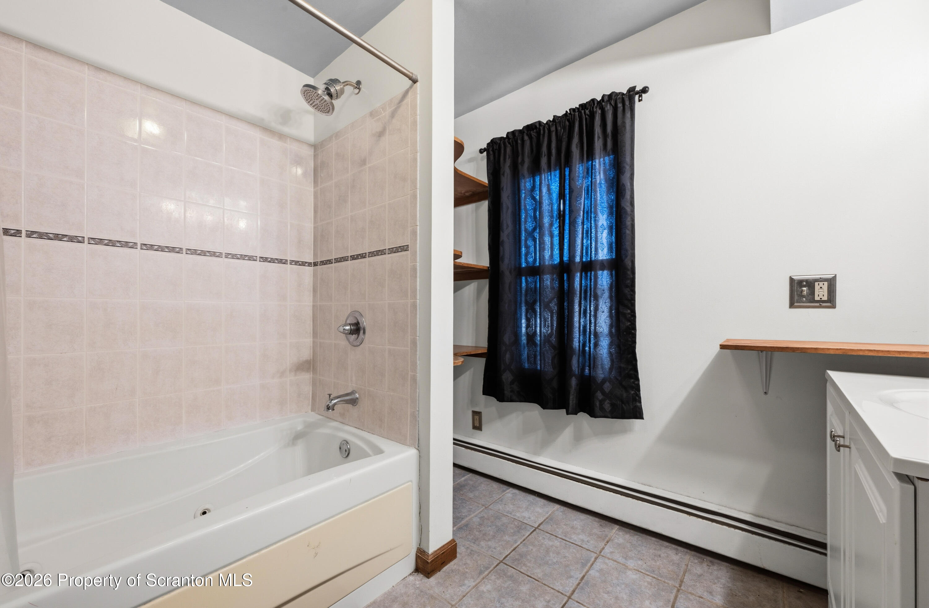 435 Foote Avenue Duryea, PA 18642 - Photo 23 of 51 a bathroom with a tub shower vanity and a sink