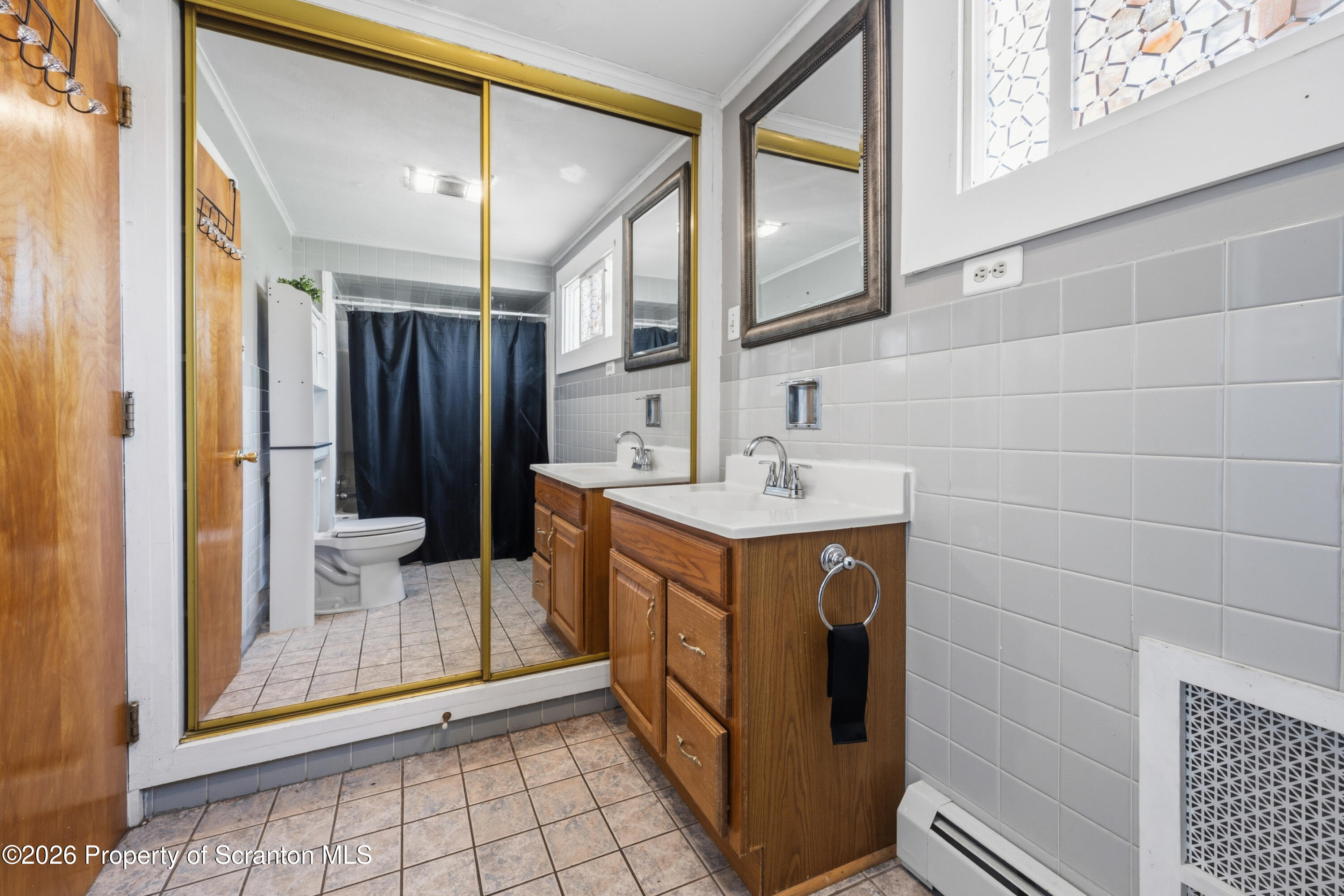 435 Foote Avenue Duryea, PA 18642 - Photo 24 of 51 a bathroom with a double vanity sink mirror and shower