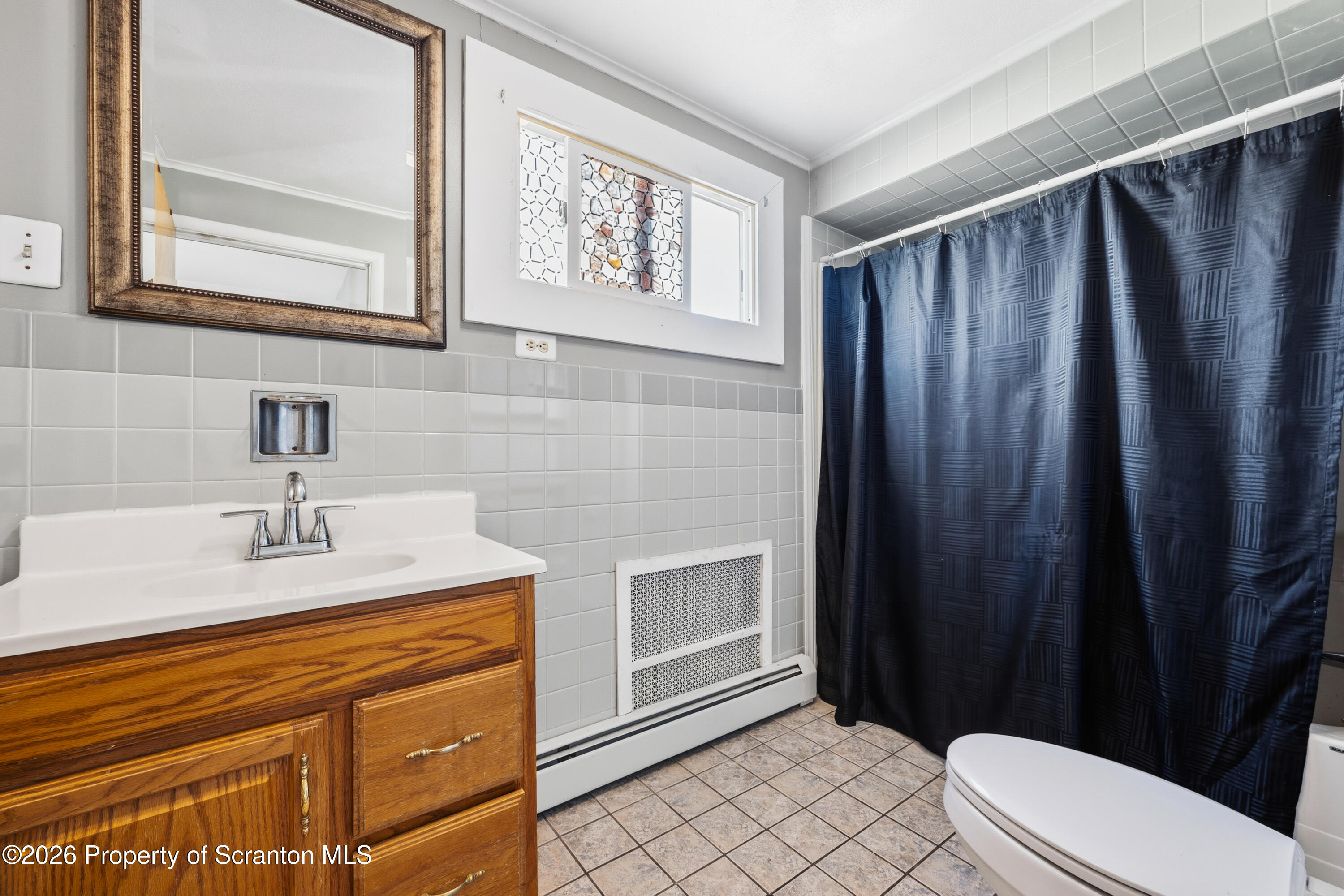 435 Foote Avenue Duryea, PA 18642 - Photo 25 of 51 a bathroom with a sink a toilet and shower