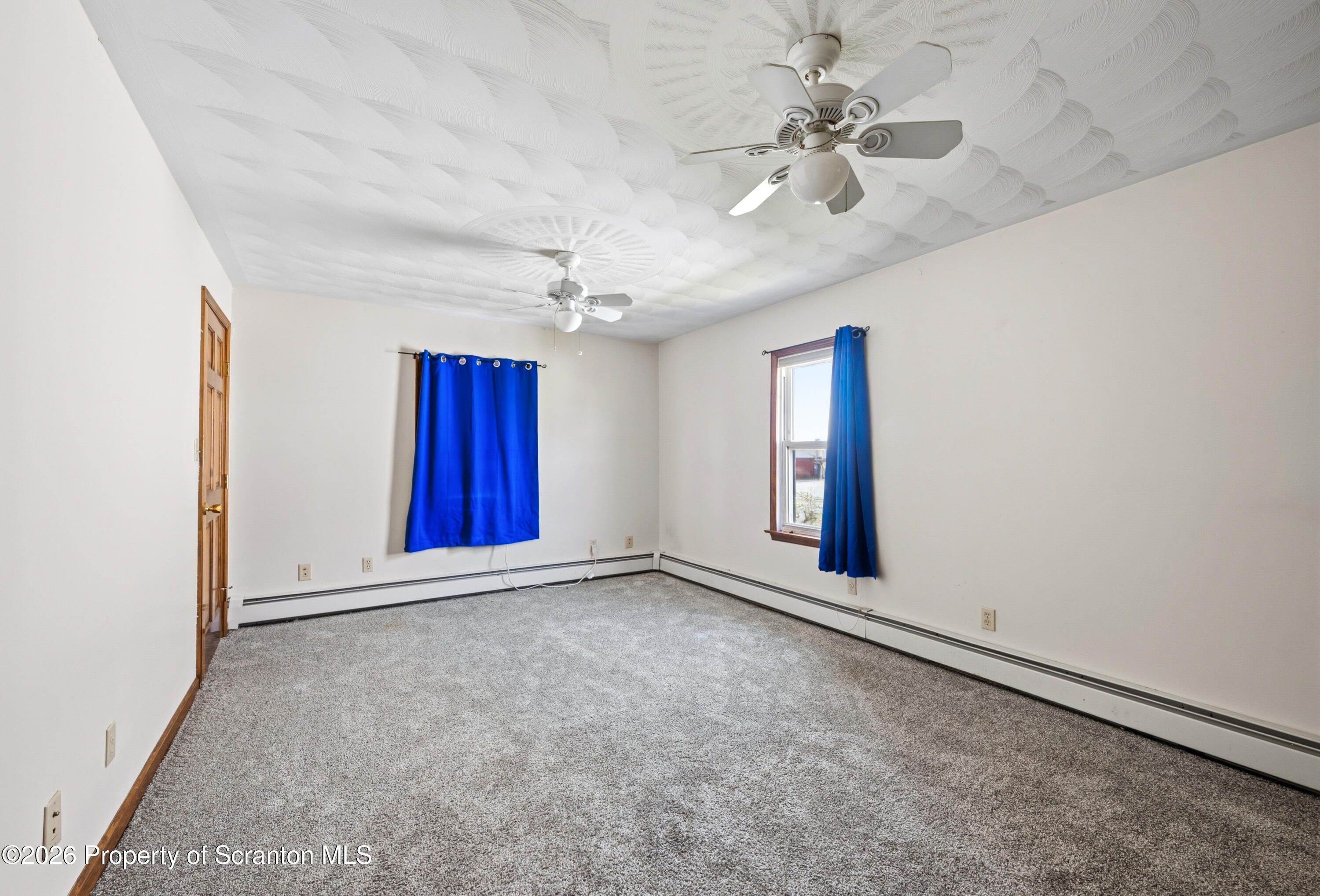 435 Foote Avenue Duryea, PA 18642 - Photo 32 of 51 an empty room with windows and fan