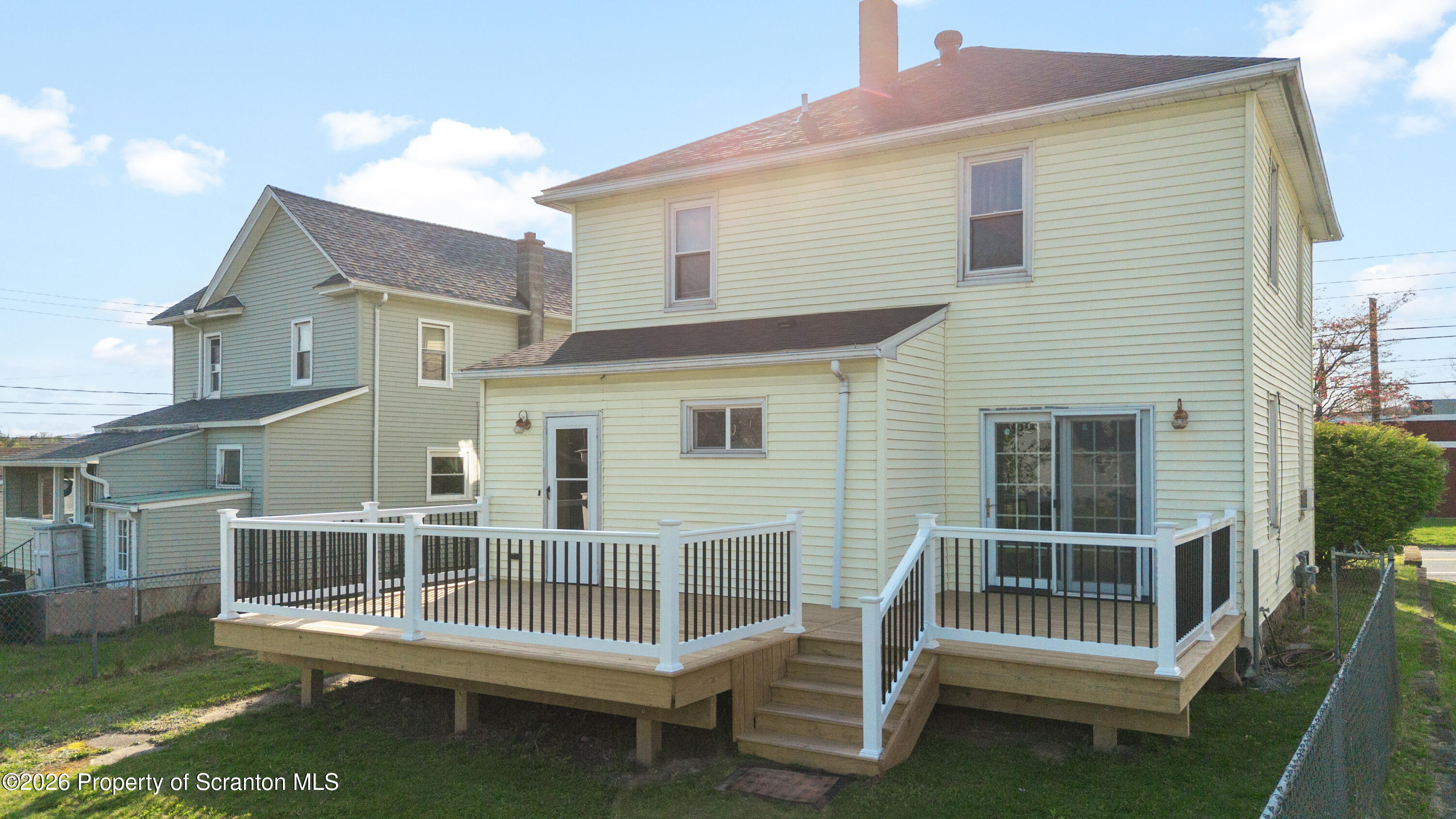 435 Foote Avenue Duryea, PA 18642 - Photo 35 of 51 a view of a house with a wooden deck and furniture