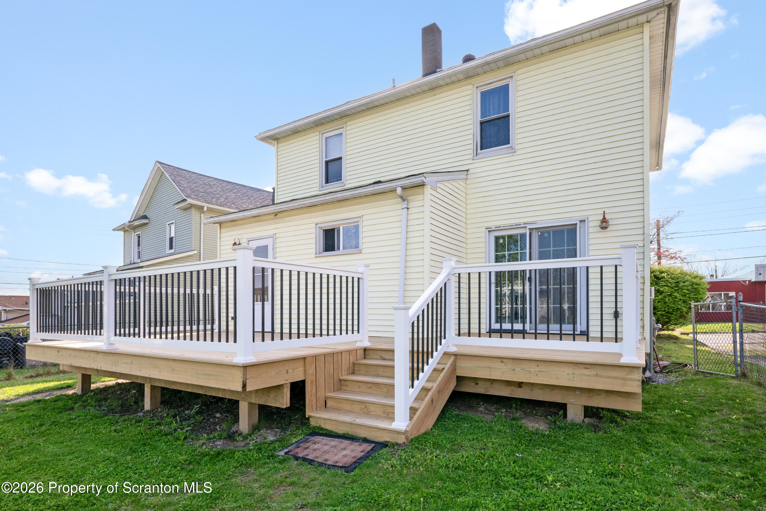 435 Foote Avenue Duryea, PA 18642 - Photo 38 of 51 a view of a house with a yard and deck