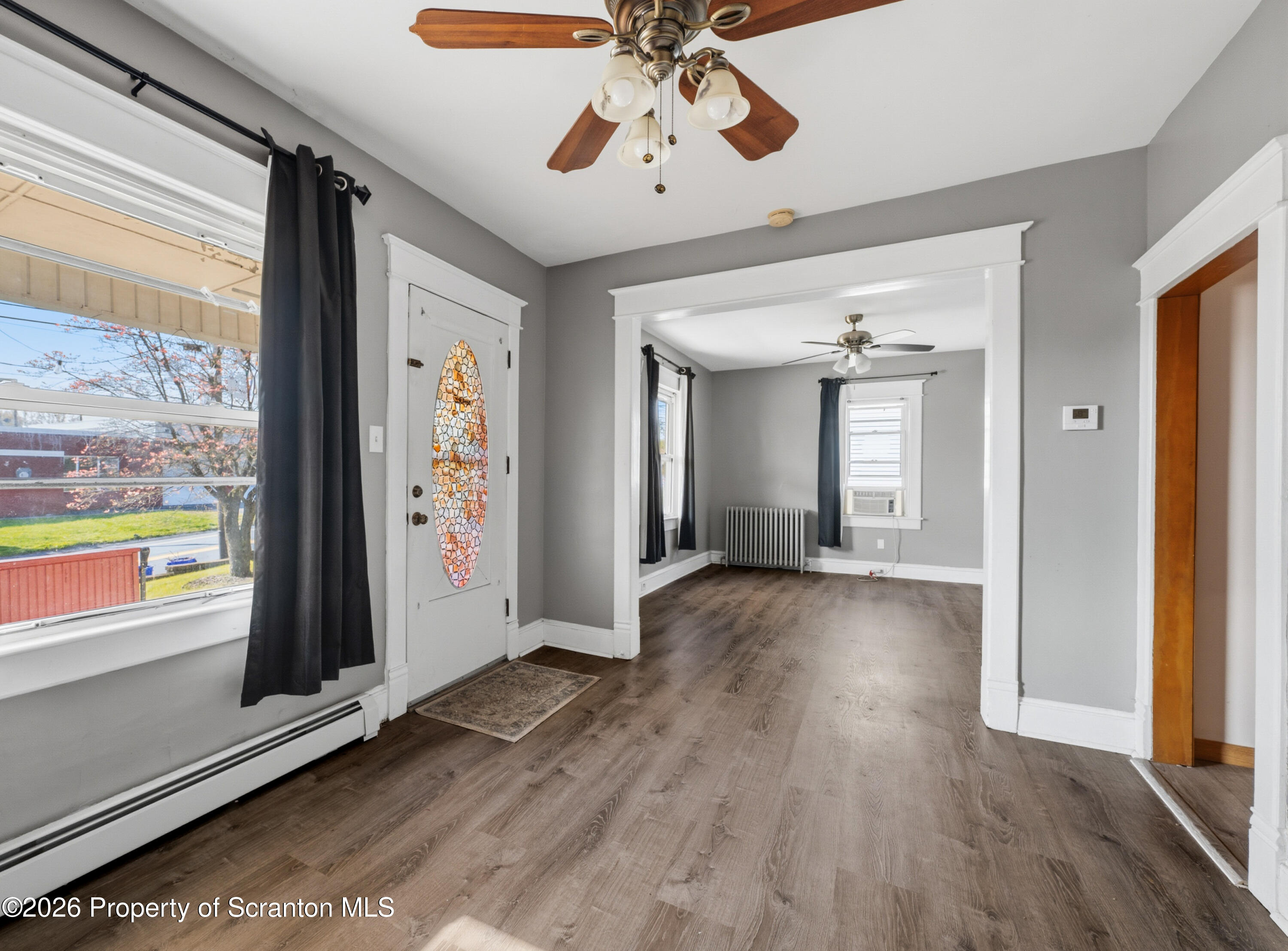 435 Foote Avenue Duryea, PA 18642 - Photo 6 of 51 a view of empty room with wooden floor and fan