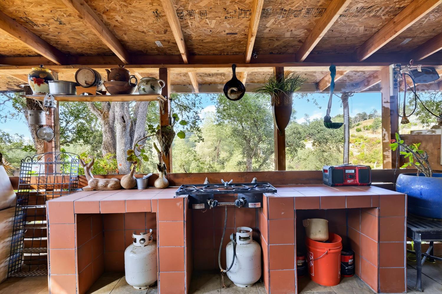 5263 Chile Camp Road Campo Seco X, CA 95226 - Photo 17 of 24 a view of an outdoor sitting area with a table and chair