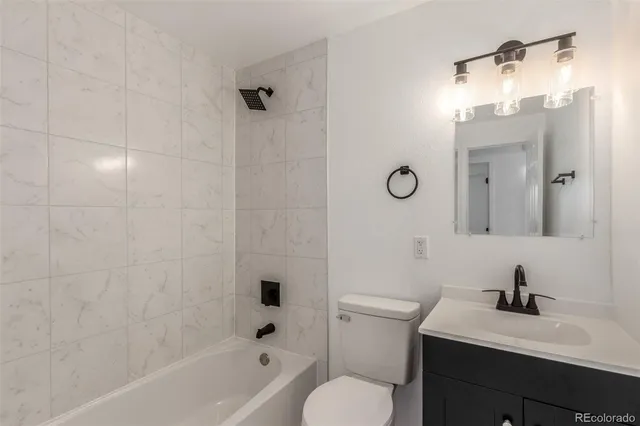 a view of a room that has wooden floor and window