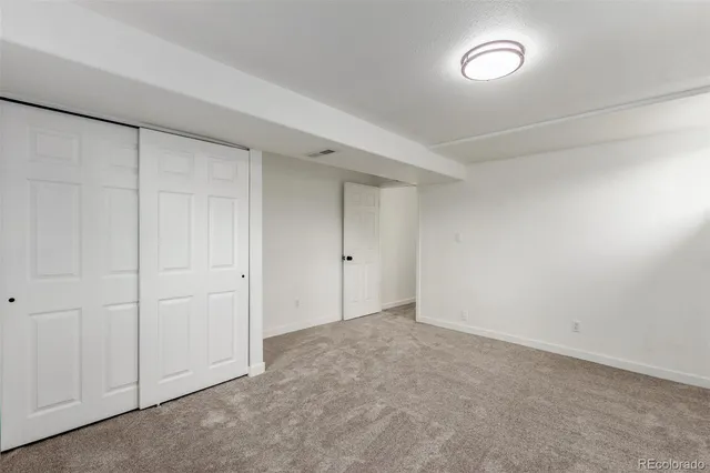 a view of a balcony with wooden floor