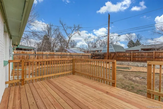 a view of a balcony with wooden floor