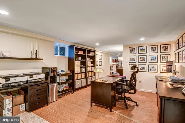 a view of a workspace with furniture and lounge chair