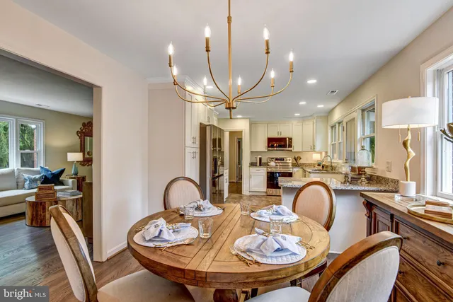 a dining room with furniture a window and kitchen view