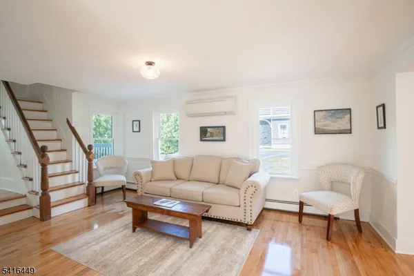 a living room with furniture and a rug