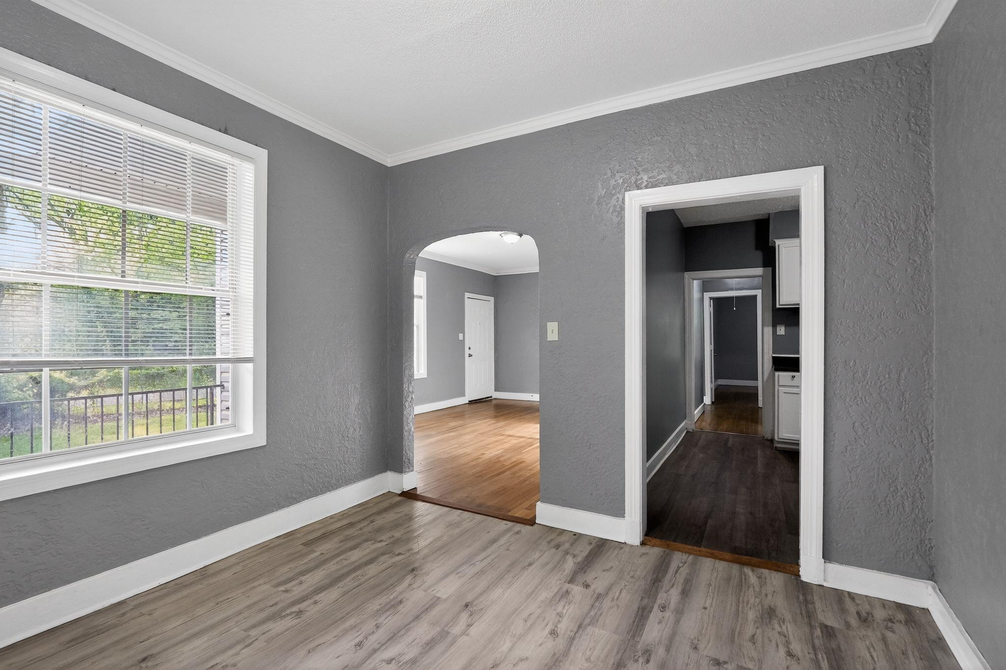 4199 Auburn Road Memphis, TN 38116 - Photo 11 of 32 Interior featuring light gray wood-finish flooring, textured gray walls, and white trim