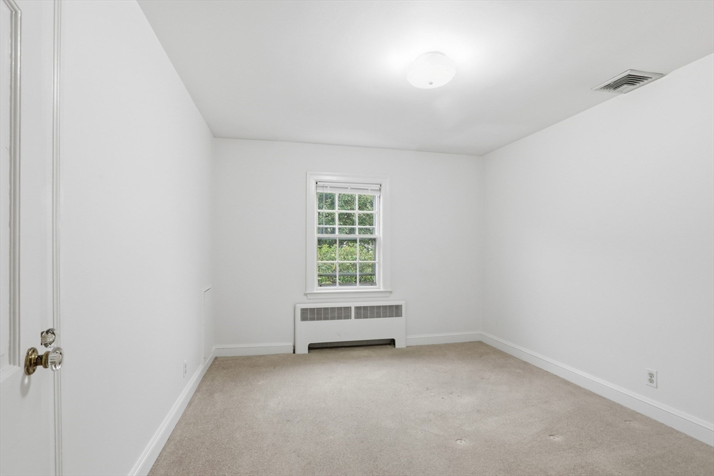 12 Canterbury Road Winchester, MA 01890 - Photo 20 of 33 a view of an empty room with a window