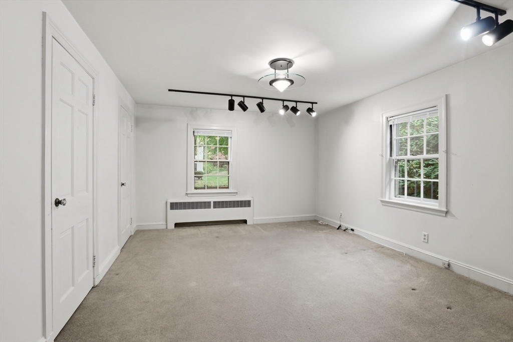 12 Canterbury Road Winchester, MA 01890 - Photo 21 of 33 an empty room with windows and fan