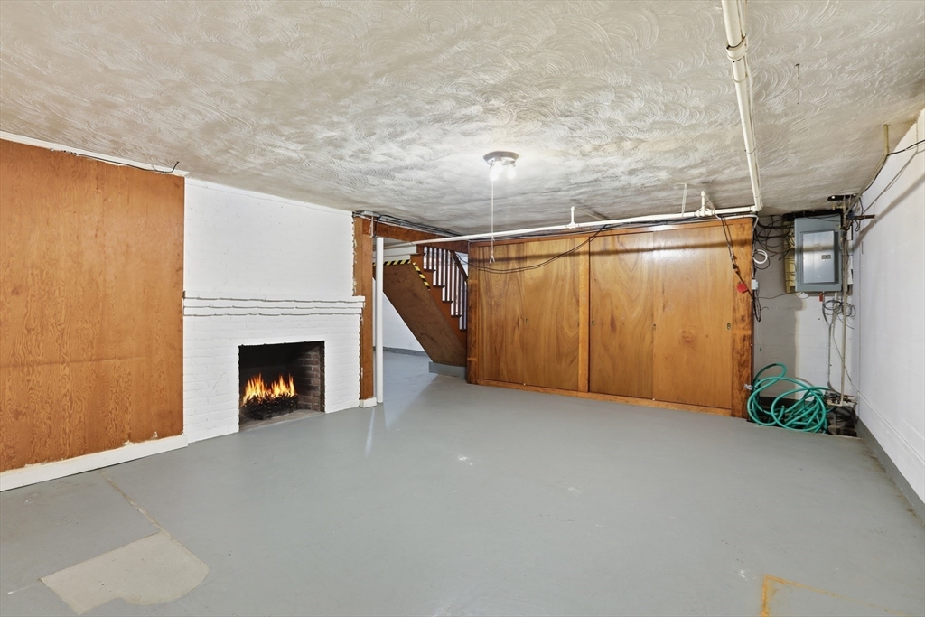 12 Canterbury Road Winchester, MA 01890 - Photo 31 of 33 a view of an empty room with a fireplace