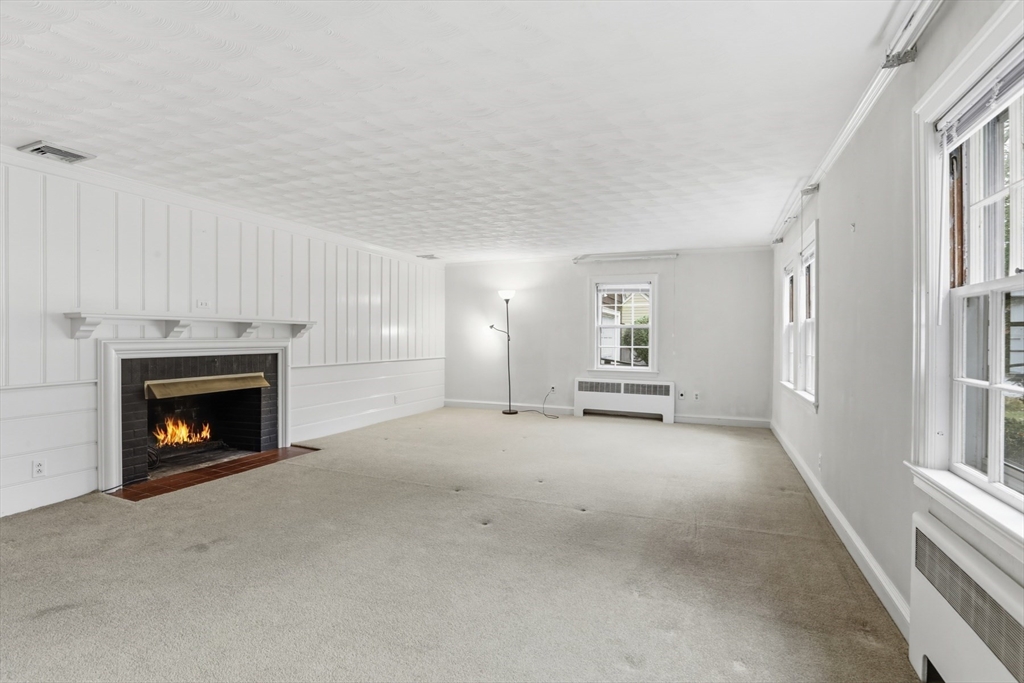 12 Canterbury Road Winchester, MA 01890 - Photo 5 of 33 a view of a livingroom with a fireplace