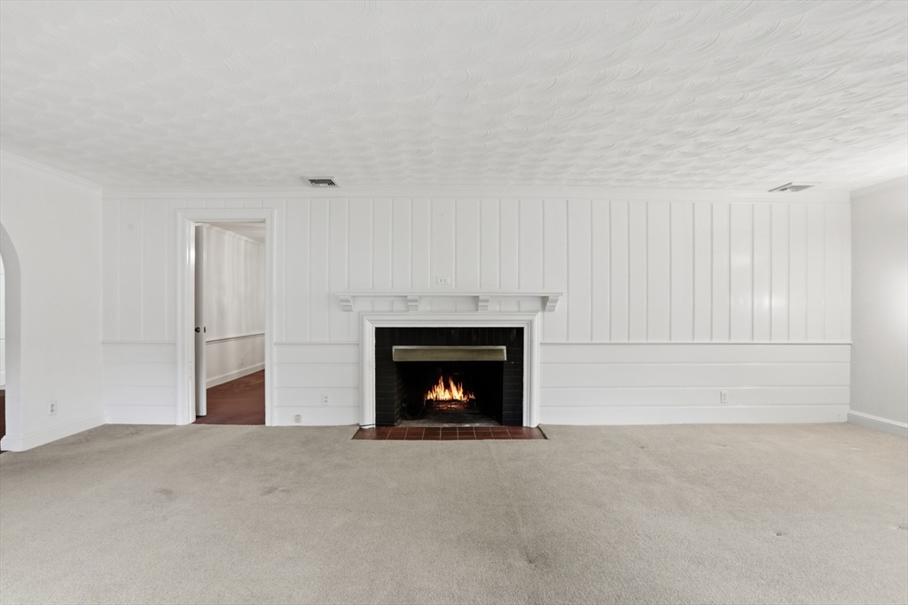 12 Canterbury Road Winchester, MA 01890 - Photo 6 of 33 a living room with a fireplace