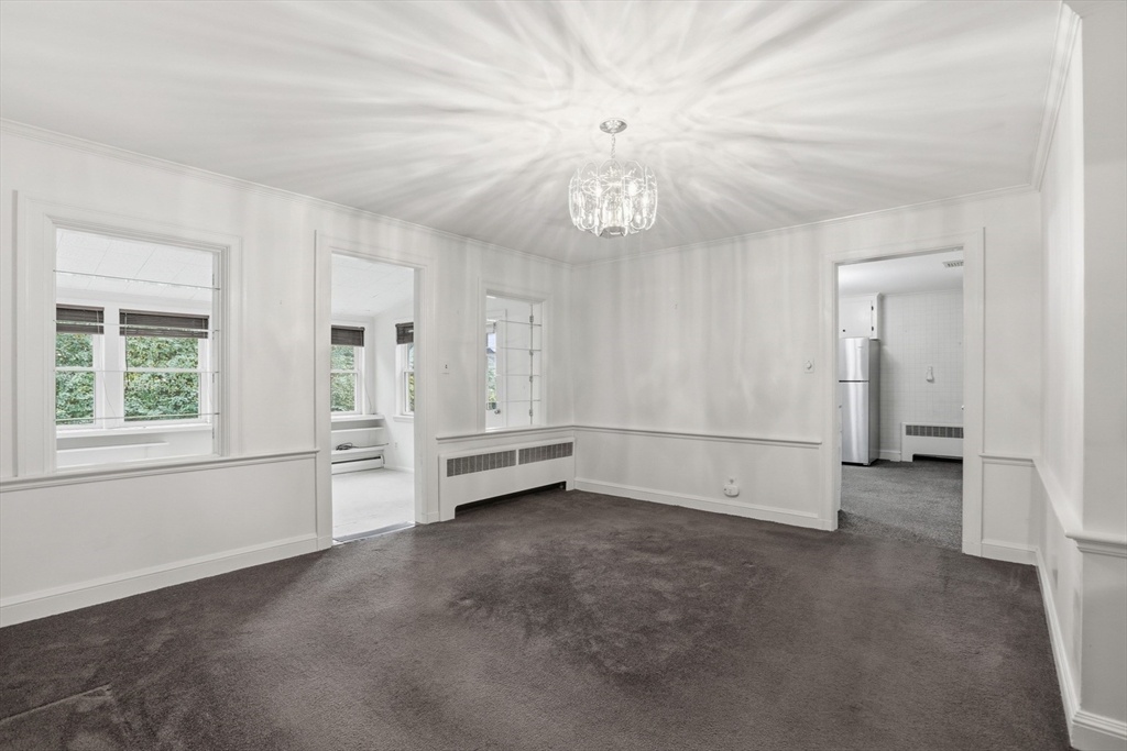 12 Canterbury Road Winchester, MA 01890 - Photo 9 of 33 wooden floor in an empty room with a window