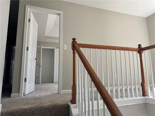 a view of a hallway with staircase
