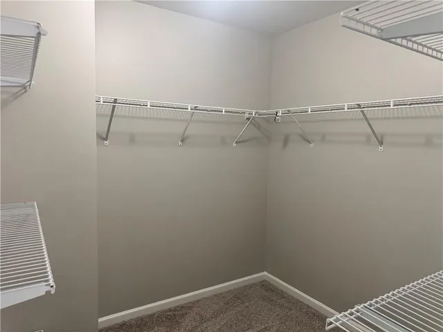 a view of an empty walk in closet